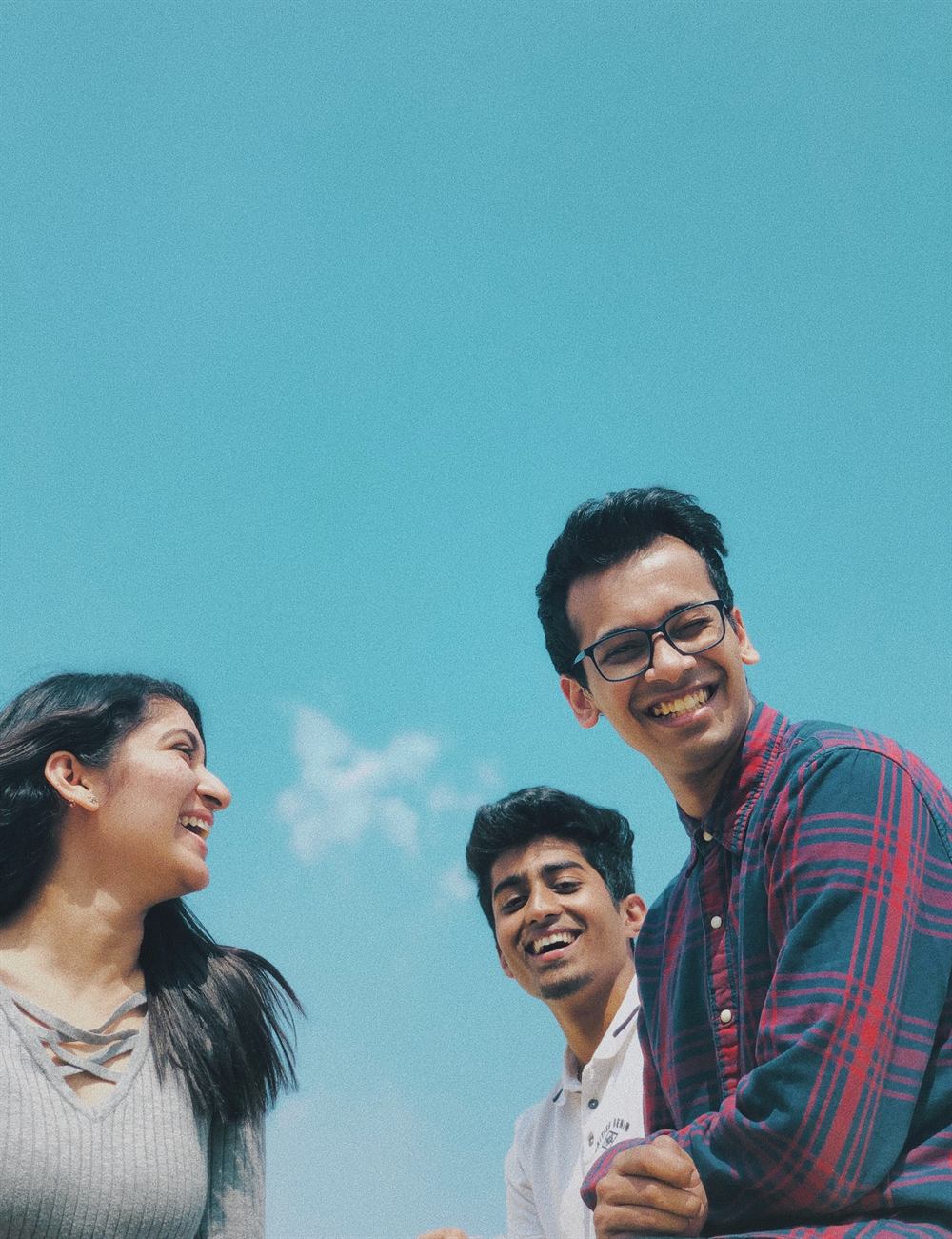 Two young people smiling outdoors