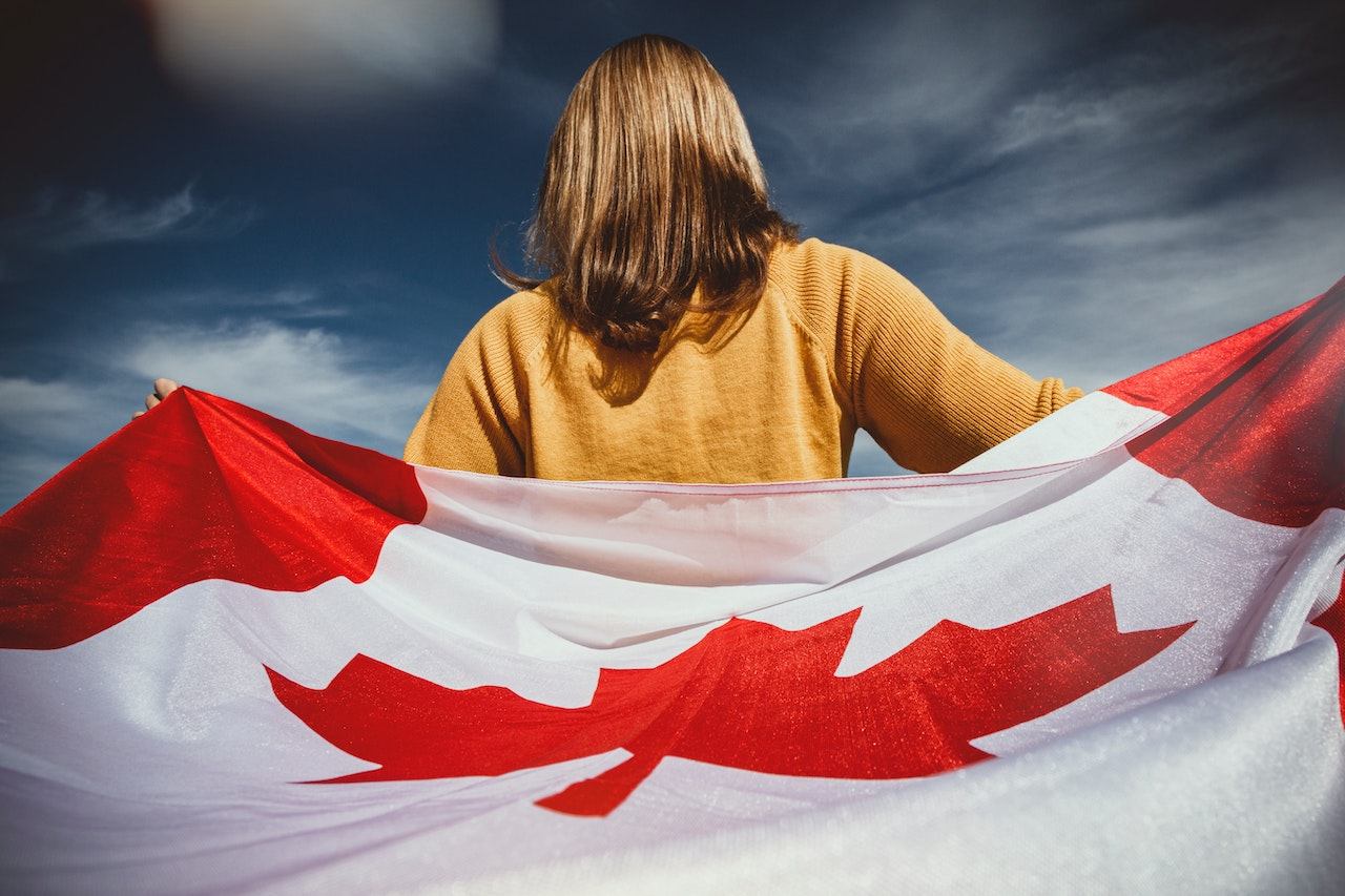A woman wrapped in a Canadian flag